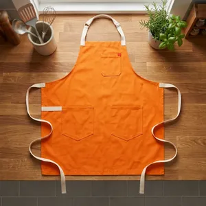 Delantal de Trabajo Resistente Color Naranja con Tres Bolsillos, de Lona Tejida, sin Mangas, Lavable a Máquina, para Limpieza y Uso Diario - Product Image 1