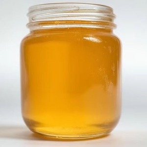 น้ำผึ้งสีส้มสดคุณภาพสูงสำหรับการรักษาบาดแผลด้วยพลังงานธรรมชาติทรีทเมนท์ความงามแบบโฮมเมดบรรจุในขวด - Product Image 1