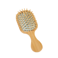 Brosse à cheveux démêlante portable mini écologique en bambou carbonisé durable avec coussin ventilé pour le toilettage quotidien et les voyages