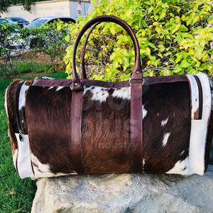 กระเป๋าเดินทางทรงดัฟเฟิลสำหรับผู้ชายหนังวัวหรูหราทำด้วยมือของผู้หญิงกระเป๋าหนังวัวหนังวัวขนาดใหญ่ - Product Image 1
