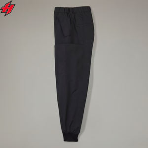 Pantalones impermeables de poliéster OEM para mujer, pantalones de nailon laterales con ambos bolsillos, cintura elástica, pantalones deportivos, pantalones cortavientos para mujer - Product Image 6