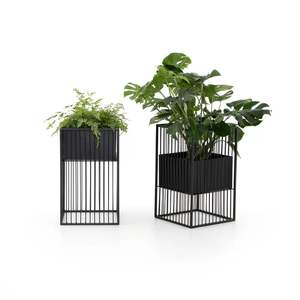 Jardinière moderne sur pied en cuivre avec base en acier noir robuste pour plantes d'intérieur, utilisée dans les maisons, les bureaux, les centres commerciaux et les halls - Product Image 1
