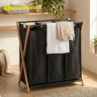 Panier à linge double pliable minimaliste avec cadre métallique en toile noire pour organiser les vêtements, à utiliser dans la cuisine ou la salle de bain
