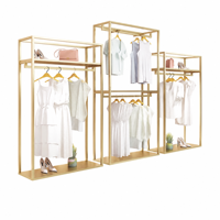 Porte-vêtements de luxe en acier inoxydable doré de haute qualité, support de présentation pour boutique avec base en MDF imitation marbre