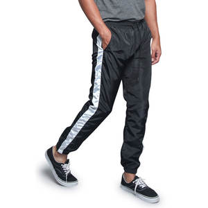 Venta al por mayor Windbreaker Jogger Pants Men Nylon Track Pants Quick Dry Professional Design Windproof Winter Trouser tracksuits - Product Image 1