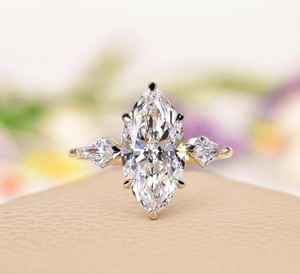 แหวนหมั้นเพชรโมอิสซาไนต์ทรงมาร์ควิส 2.0 กะรัต ธรรมชาติ สีใส เงินแท้ 925 ชุบทอง 14K ดีไซน์เรียบหรู สำหรับงานแต่งงาน - Product Image 1