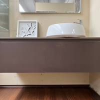 Meuble-lavabo mural moderne de marque italienne, finition marron chocolat mat, avec dessus en porcelaine aspect pierre, tiroir spacieux, prêt à l'emploi avec robinetterie de salle de bain