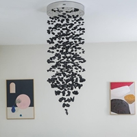 Lampe suspendue LED en acier au design nordique personnalisé, avec pendentif en spirale en pierre de charbon, idéale pour plafonds hauts, villas, hôtels, salons et escaliers