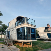 Capsule spatiale préfabriquée double couche personnalisable avec escalier intérieur et verre intimité, idéale pour la construction de stations balnéaires