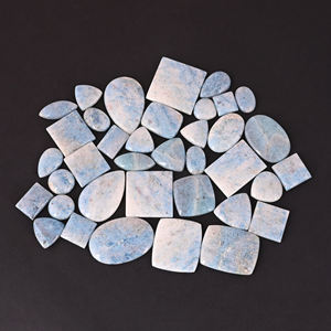ขายส่งล็อต 32 ชิ้น หินโทรลไลต์สีน้ำเงินธรรมชาติทรงคาโบชอง น้ำหนัก 117.64 กรัม ขนาดฟรีไซส์ คุณภาพ AA จาก Ishu Gems สำหรับทำเครื่องประดับที่ไม่เหมือนใคร - Product Image 1