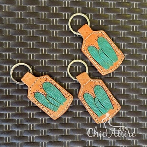 ห่วงโซ่กุญแจหนังที่แกะสลักด้วยมือรูปทรงแปลกใหม่น่ารักอุปกรณ์เสริมพวงกุญแจหนังสำหรับทุกเพศ - Product Image 1