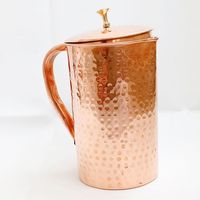 Pichet rond en cuivre avec couvercle étanche et base solide, parfait pour la désintoxication ayurvédique et les pratiques de l'eau saine
