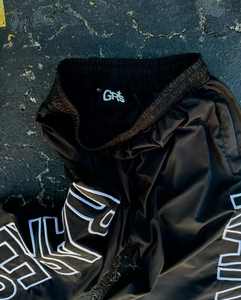 Ropa de calle personalizada de alta calidad, pantalones de chándal acampanados de nailon, pantalones de chándal informales holgados con estampado lateral para hombre, pantalones cortavientos - Product Image 6