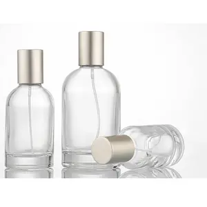 Bouteilles de parfum en verre cylindrique de luxe personnalisées: disponibles en tailles de 30ml, 50ml et 100ml, transparentes et complètes avec bouchons