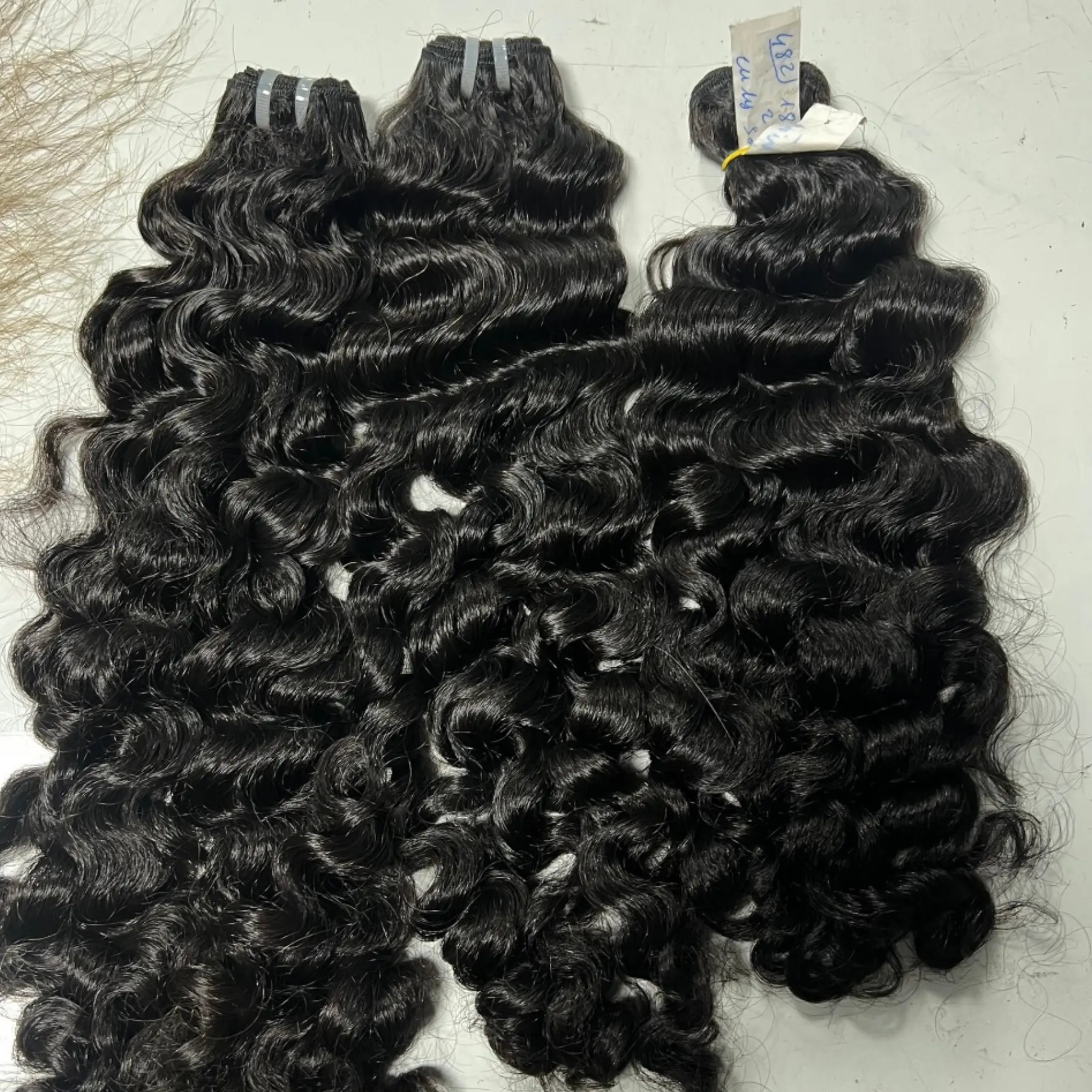 Необработанные натуральные волосы в пучке, вьетнамские волнистые черные волосы, произведенные фабрикой Hairvietnam