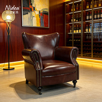 Fauteuil de salon de luxe artisanal en cuir marron foncé, fauteuil d'appoint rétro à dossier haut, canapé de lecture pour club de gentlemen et bar