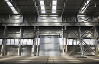 Porte de garage sectionnelle contemporaine Tradivas TRD4 de haute qualité, compatible avec les niveleurs de quai et le système d'interverrouillage automatisé