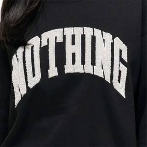 เสื้อสเวตเตอร์สีดำแนวสตรีทมีดีไซน์เป็นเอกลักษณ์และชายเสื้อแบบมีโครงเหมาะสำหรับชุดลำลองและแนวสตรีท - Product Image 6