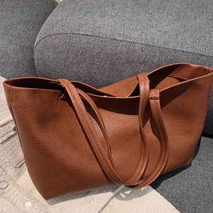 A sophisticated dark brown leather <b>tote</b> , featuring a classic design and subtle logo, perfect for work or everyday use - Product Image 2