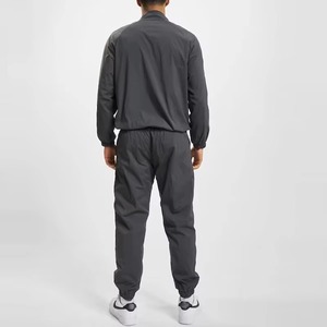 Ropa deportiva personalizada para hombre, chándal ligero de nailon 100% con bolsillos, cortavientos de Color sólido bordado con logotipo OEM - Product Image 4