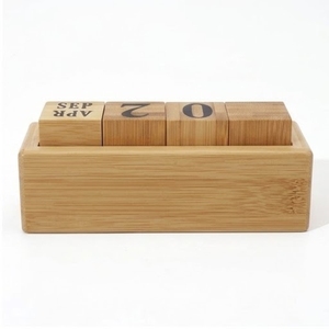 This handcrafted wooden desktop <b>calendar</b> is a reusable and eco-friendly office accessory - Product Image 1