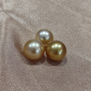 Perla marina dorada de 14 mm de grado AA que exuda una elegancia atemporal, ideal para crear joyas lujosas y adornos elegantes. - Product Image 2