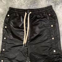 Pantalon d'athlétisme à boutons latéraux en nylon personnalisé de haute qualité pour l'extérieur coupe-vent imperméable pantalon en polyester pour hommes
