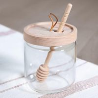 Venta caliente tarro de miel soporte de contenedor de vidrio con tapa de acacia de madera y cucharón tarro de almacenamiento de alimentos de vidrio de alta calidad con tapa