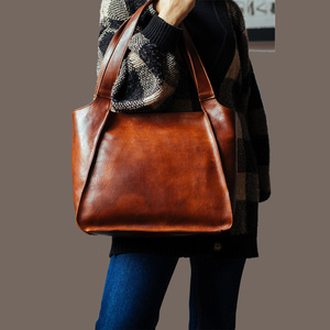 Venta al por mayor de lujo unisex bolso de mano de cuero genuino con cierre de cremallera logotipo personalizado diseño unisex para las mujeres - Product Image 6