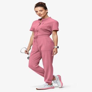 Mono médico rosa para mujer con cuello mandarín, manga corta, cremallera frontal y cintura ajustable - Product Image 1