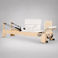 Machine de Pilates Reformer de qualité professionnelle avec un cadre en érable nord-américain massif et des ressorts allemands pour les studios de prestige