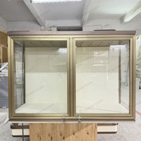 Vitrine à bijoux en verre brossé doré à double porte avec éclairage LED sécurisé, fabrication sur mesure OEM pour boutique