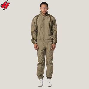 Ensemble coupe-vent de survêtement en nylon Oem pour hommes, veste coupe-vent 2 pièces vierge de couleur unie personnalisée et ensemble de vêtements d'extérieur de jogging pour hommes - Product Image 1