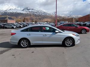 Hyundai Sonata 2016 FWD d'occasion, essence/électrique/hybride, boîte automatique/manuelle, sièges en cuir, caméra de recul, 16 pouces, côté gauche, foncé - Product Image 4