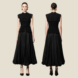 La falda Lyly Midi trae una silueta elegante y una tela de cupro suave con patrones de hojas para un aspecto pulido de día a noche - Product Image 1