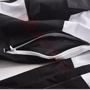 Pantalones de esquí blancos con paneles de contraste negros Pantalones de nieve impermeables con dobladillo elástico de cintura ajustable y forro polar cálido - Product Image 6