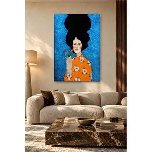 Impresión en lienzo de Fida: Mujer sosteniendo flores silvestres sobre fondo azul - Product Image 1