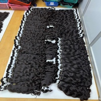 Venta al por mayor de extensiones de cabello liso indio natural alineado con cutícula virgen 28-30 pulgadas cinta ondulada natural paquetes de cabello humano exportación