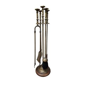 Elegant <b>fire</b> <b>tool</b> set in polished brass with curved design and strong build crafted for classic decor or winter gatherings - Product Image 1