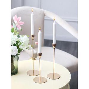 Intricately detailed brass candle holder featuring classic <b>Victorian</b> motifs and a radiant antique finished for grandeur - Product Image 1