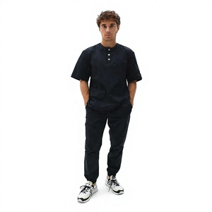 Ensemble de blouses médicales unisexe noir en tissu tissé coton-polyester, uniforme d'hôpital avec pantalon inclus, détection d'aiguilles, fusion sans couture, personnalisable - Product Image 1