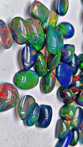 โอปอลสีดำเวโลไฟจากเอธิโอเปีย เกรดพรีเมียม ทรงหลังเบี้ย หินประจำเดือนตุลาคม  แบบหลวม  ผ่านการขัดเงา/เคลือบน้ำมัน  ขนาด 2-5 กะรัต - Product Image 6