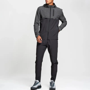 Trajes deportivos cortavientos para hombre con logotipo personalizado, chaqueta cortavientos de dos piezas y pantalones de chándal, conjunto de chándal cortavientos de nailon - Product Image 1