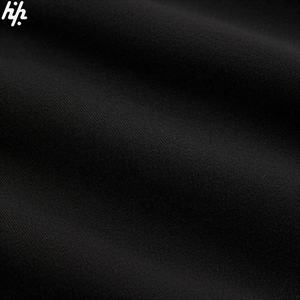 Sweat à capuche noir élégant avec logo géométrique blanc Tissu doux Poignets côtelés Poche kangourou pratique Accessoire de mode sans effort - Product Image 4