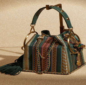 Stylish bucket <b>bag</b> with colorful vertical stripes and <b>gold</b> hardware. Available at wholesale prices. Trendy and fun. - Product Image 1