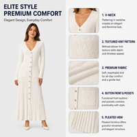 FNJIA Nouvelle Robe Élégante Blanche pour Femme, Tricotée Creuse, Col en V Ample, Manches Longues Boutonnées, Simple, Longueur Midi, Naturelle et Respirante
