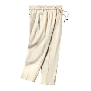 Sand linen <b>pants</b> with an elastic waist, button-fly, zippered side pocket, and sewn pleats, offering a breezy, relaxed fit - Product Image 3