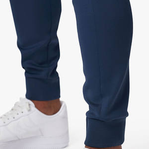 Joggers bleus durables de haute qualité pour hommes Ceinture élastique et panneau latéral contrasté en blanc avec poches - Product Image 3