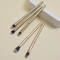 Dongshen Vente en gros Ensemble de 8 pinceaux de maquillage pour le visage en aluminium doré pour femmes, haute qualité, synthétique végétalien, plat, estompant, angulaire, blush