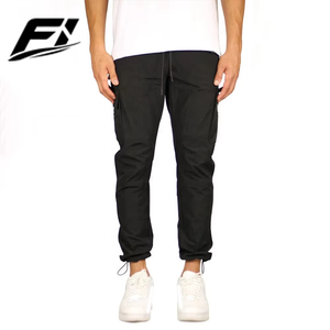 Pantalones deportivos de nailon transpirables personalizados, de secado rápido, con bolsillos con cremallera, talla grande, informales, para entrenamiento, para hombre, proveedor mayorista - Product Image 1